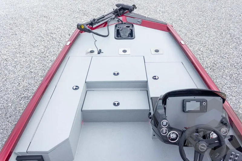 Slide: The Image of 2026 Vexus Defender 189 boat interior with steering console and storage compartments. - 23