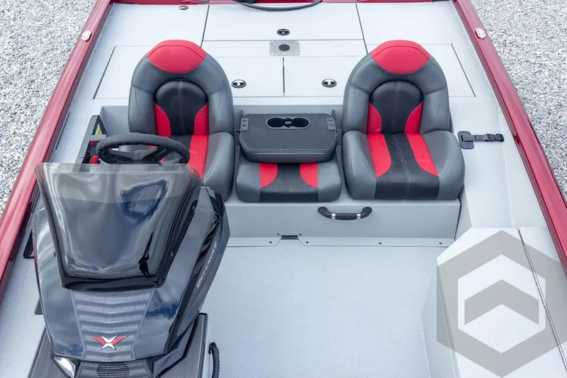 Slide: The Image of 2026 Vexus Defender 189 boat interior with red and black seats, steering console, and cup holder. - 30