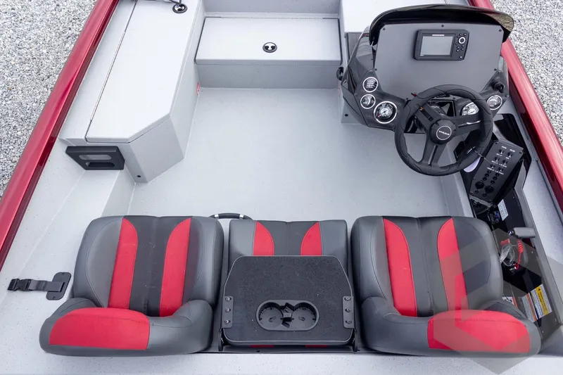 Slide: The Image of 2026 Vexus Defender 189 boat interior with red and gray seats, steering console, and controls. - 34