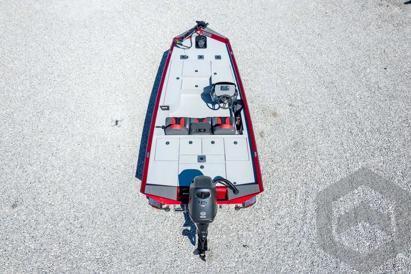 Slide: The Image of 2026 Vexus Defender 189 boat, aerial view, red and gray design, gravel background. - 50