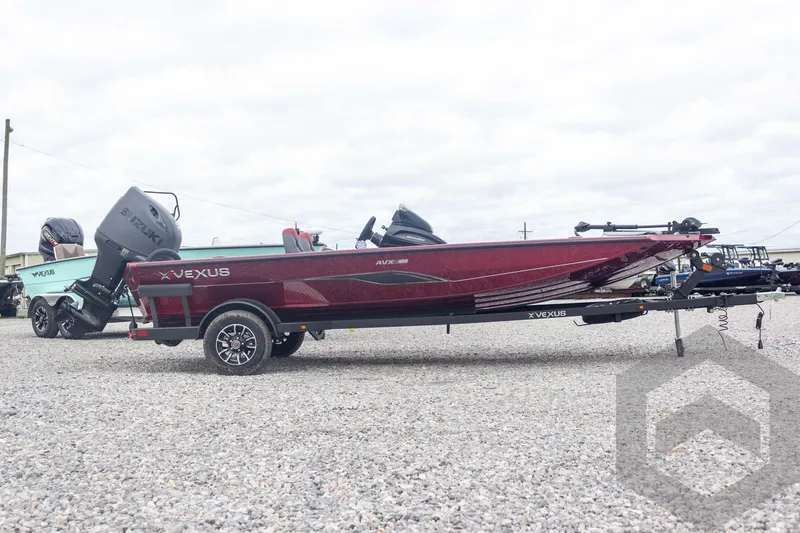 Slide: The Image of 2026 Vexus Defender 189 boat on trailer, featuring sleek design and powerful engine. - 8