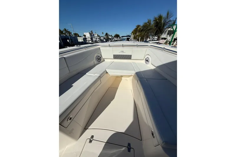 Slide: The Image of 2022 Cobia 320 Center Console boat interior with spacious seating and sleek design. - 25