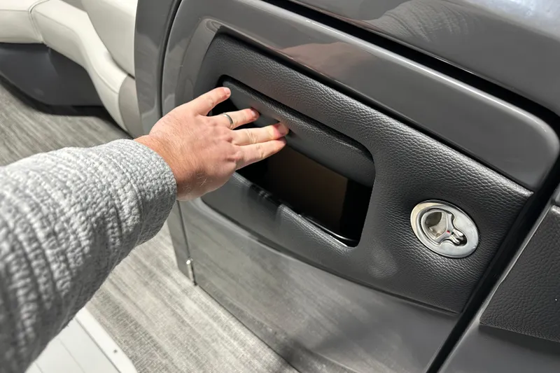 Slide: The Image of 2026 Godfrey MC 235 SBC boat interior with luxury seating and table setup. - 11