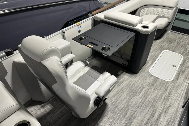 Slide: The Image of 2026 Godfrey MC 235 SBC boat interior with modern helm and luxurious seating. - 6