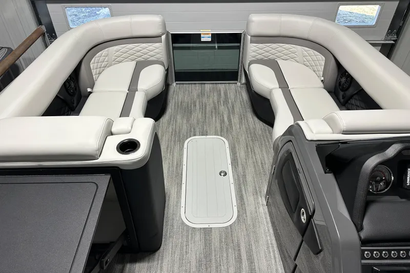 Slide: The Image of Luxurious interior of 2026 Godfrey MC 235 SBC boat with plush seating and table. - 7