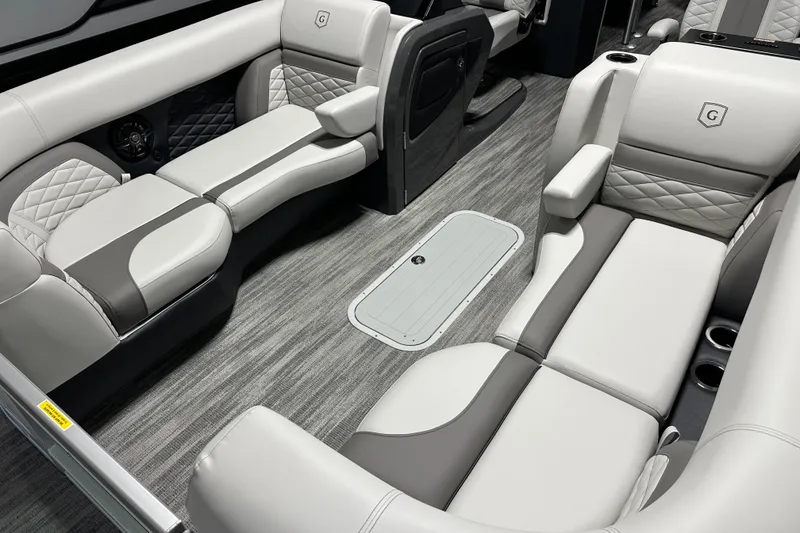 Slide: The Image of Interior view of 2026 Godfrey MC 235 SBC boat with modern seating and safety gate. - 9