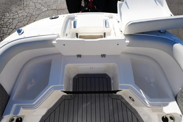 Slide: The Image of 2021 Sea Ray SDX 250 boat interior with open storage compartments and sleek design. - 10