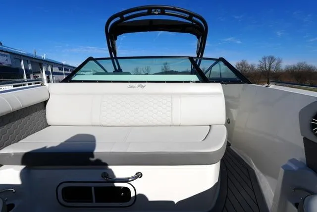 Slide: The Image of 2021 Sea Ray SDX 250 boat interior with cushioned seating and sleek design. - 11