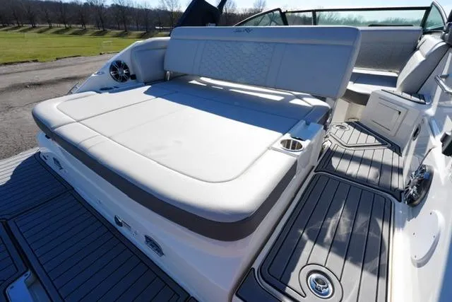 Slide: The Image of 2021 Sea Ray SDX 250 boat interior with spacious seating and modern design. - 16
