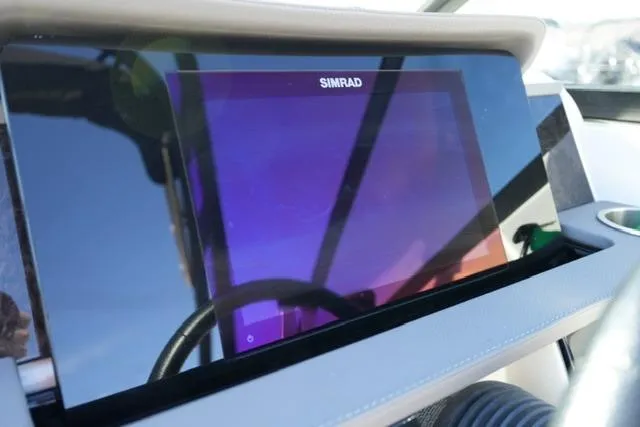 Slide: The Image of Simrad display on 2021 Sea Ray SDX 250 boat dashboard. - 17