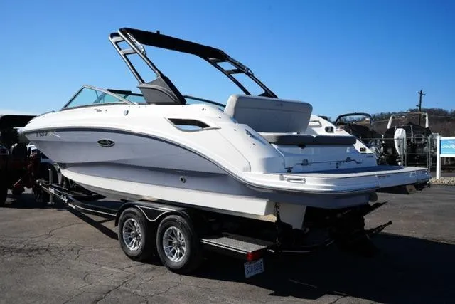 Slide: The Image of 2021 Sea Ray SDX 250 boat on trailer, sleek design, sunny day, outdoor setting. - 7