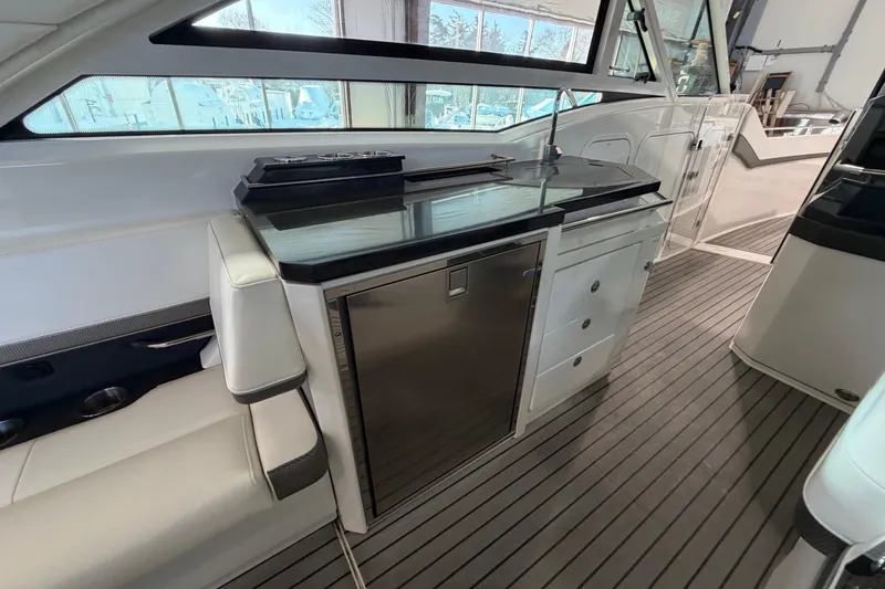 Slide: The Image of 2017 Formula 430 Super Sport Crossover interior with kitchenette and seating area. - 14