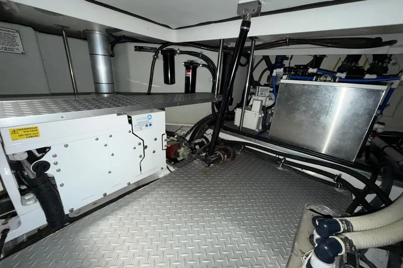 Slide: The Image of Engine room of 2017 Formula 430 Super Sport Crossover with mechanical components and wiring. - 16