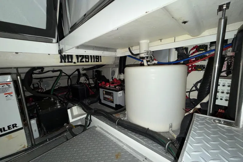 Slide: The Image of Engine compartment of 2017 Formula 430 Super Sport Crossover with batteries and wiring. - 18