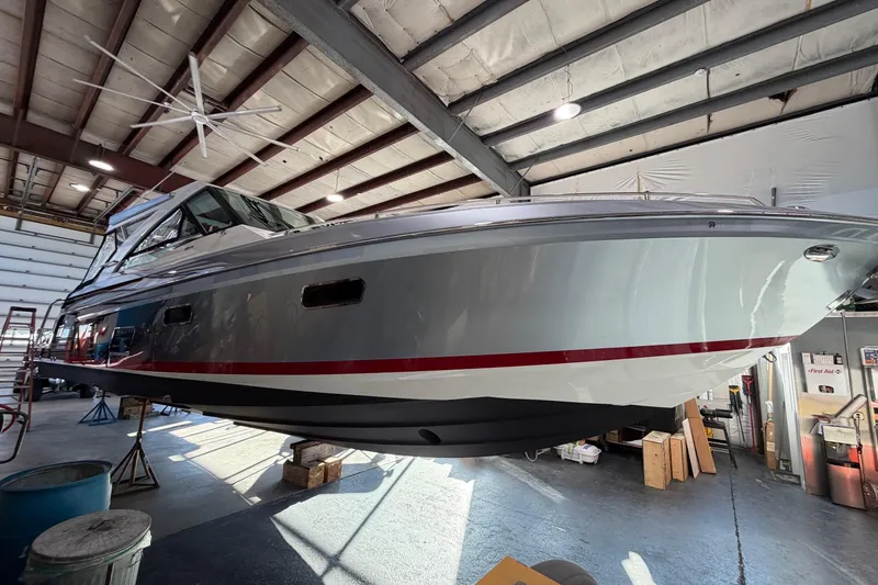 Slide: The Image of 2017 Formula 430 Super Sport Crossover boat in a warehouse setting. - 3