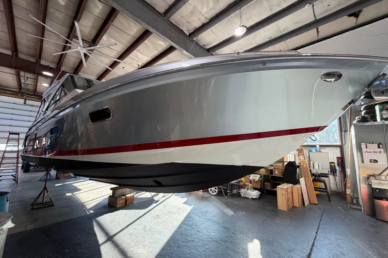 Slide: The Image of 2017 Formula 430 Super Sport Crossover boat in a storage facility. - 4