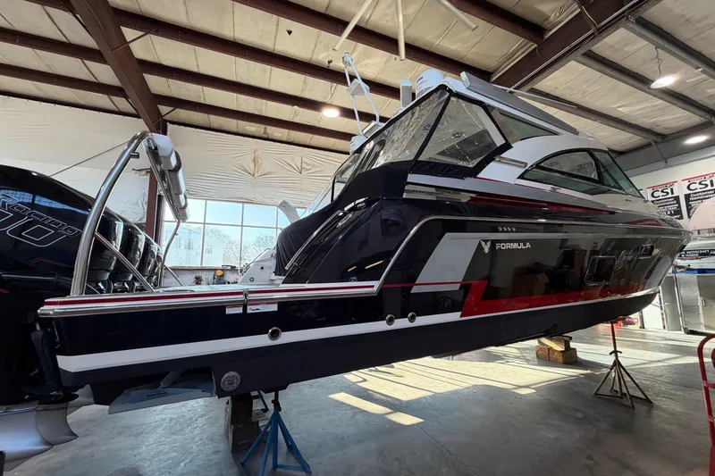 Slide: The Image of 2017 Formula 430 Super Sport Crossover boat in a warehouse, side view. - 5