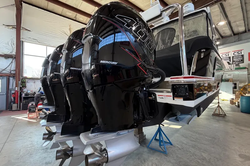 Slide: The Image of 2017 Formula 430 Super Sport Crossover with Mercury outboard engines in a workshop setting. - 7