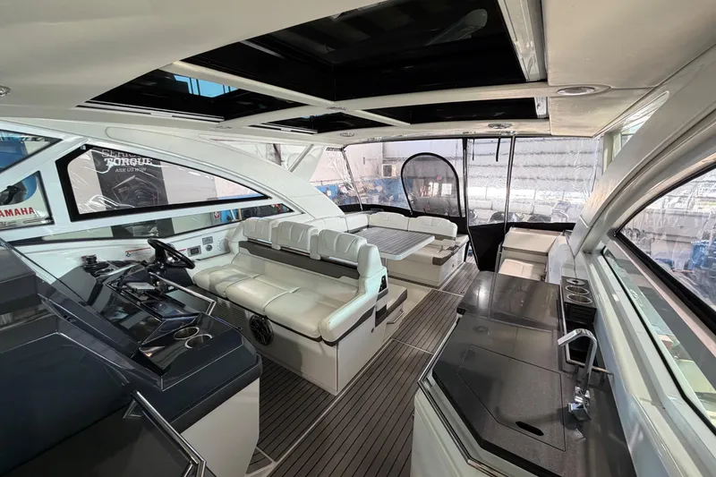 Slide: The Image of 2017 Formula 430 Super Sport Crossover yacht interior with luxurious seating and modern amenities. - 9