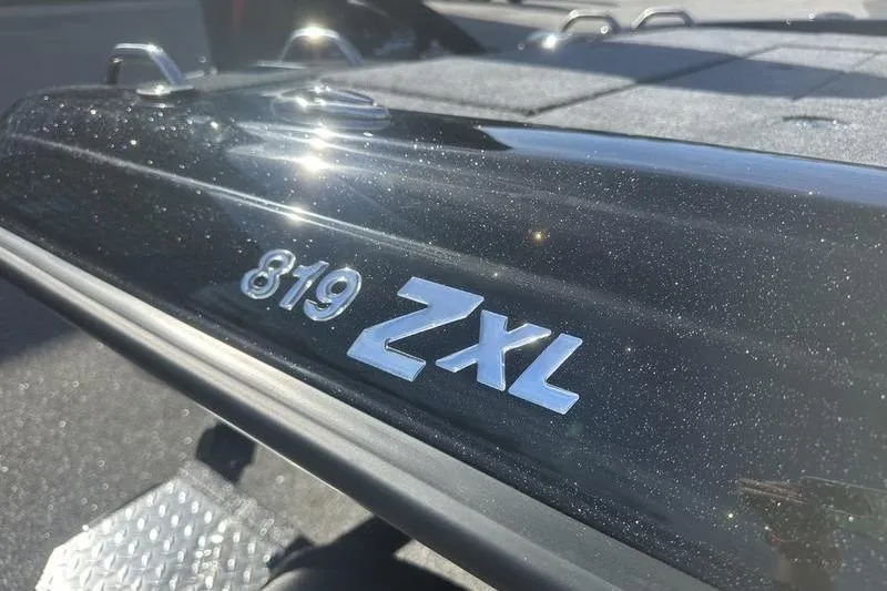 Slide: The Image of 2026 Phoenix 819 ZXL boat model emblem in sunlight. - 5
