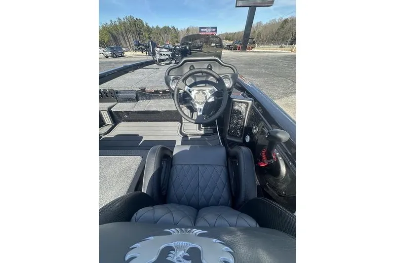 Slide: The Image of Interior view of 2026 Phoenix 819 ZXL boat cockpit with steering wheel and controls. - 7