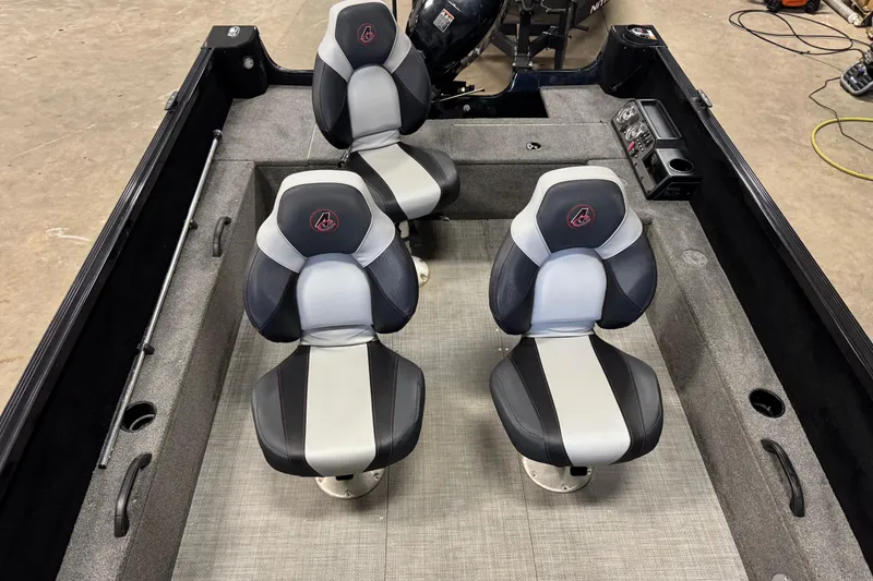 Slide: The Image of 2020 Alumacraft Competitor 165 Tiller interior with four seats and control panel. - 15