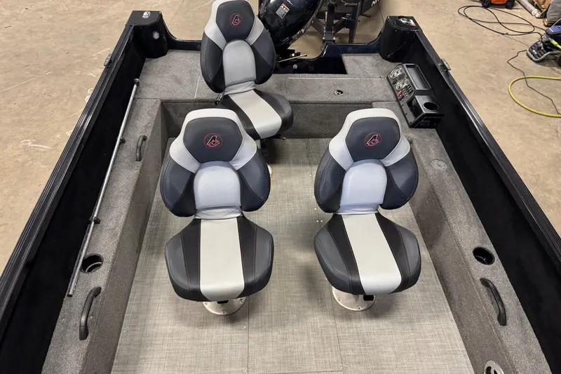 Slide: The Image of 2020 Alumacraft Competitor 165 Tiller interior with four seats and control panel. - 16