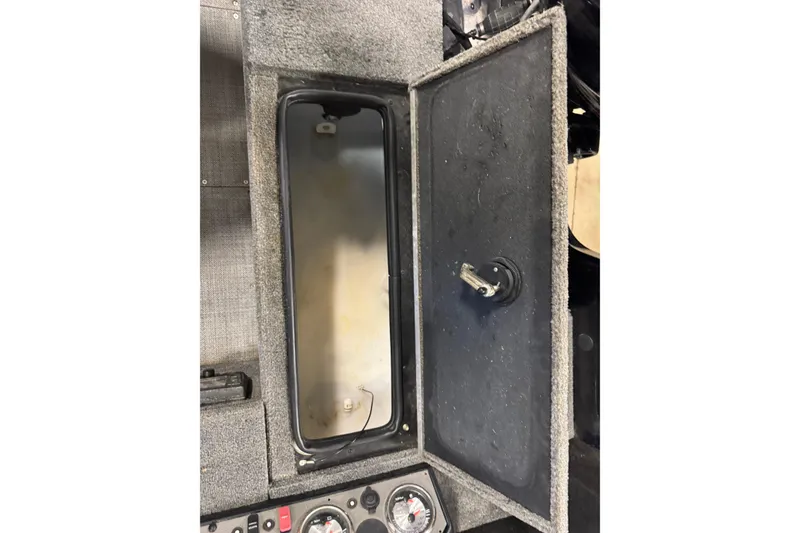 Slide: The Image of Open storage compartment in 2020 Alumacraft Competitor 165 Tiller boat interior. - 17