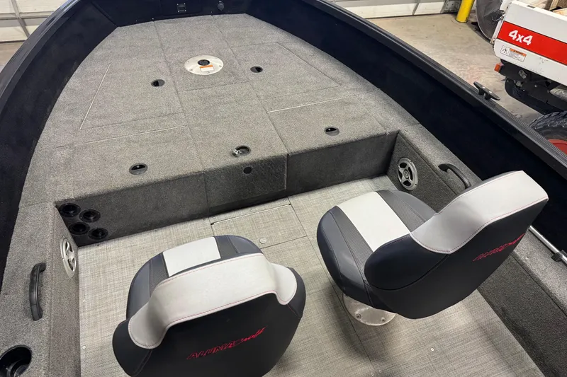 Slide: The Image of 2020 Alumacraft Competitor 165 Tiller interior with two seats and spacious deck. - 7