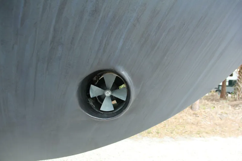 Slide: The Image of Close-up of a 2004 Cabo 48 Flybridge boat's bow thruster. - 55