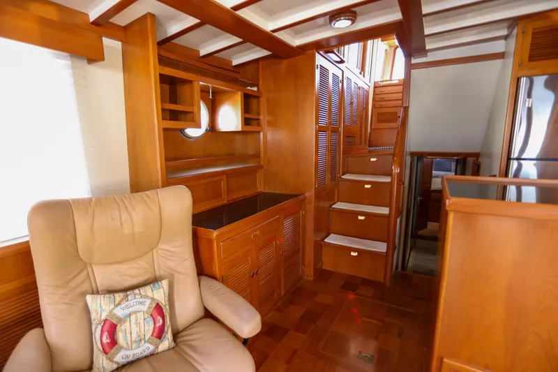 Slide: The Image of Luxurious interior of 2008 Kadey-Krogen 48 North Sea yacht with wooden cabinetry and stairs. - 11