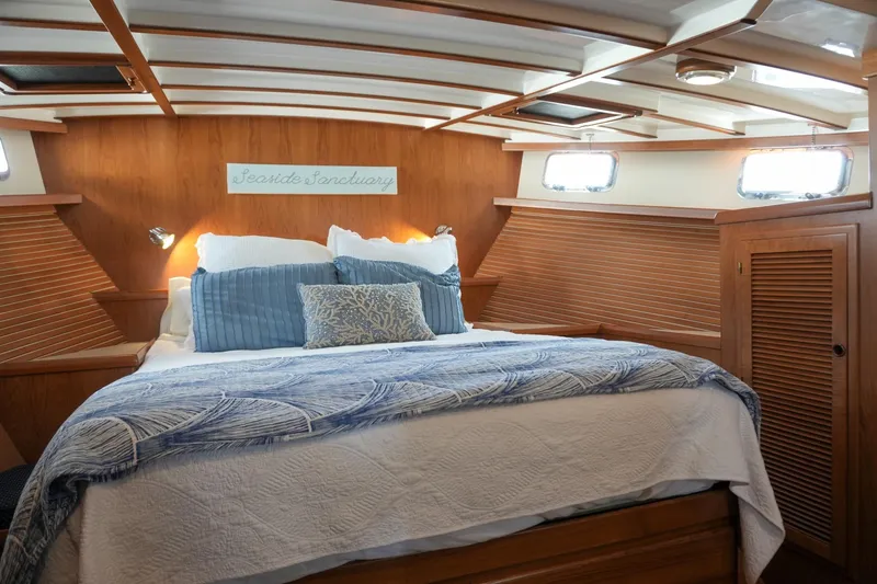 Slide: The Image of Luxurious 2008 Kadey-Krogen 48 North Sea yacht bedroom with cozy bedding and wood paneling. - 31