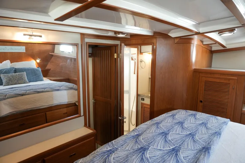 Slide: The Image of Luxurious 2008 Kadey-Krogen 48 North Sea yacht interior with cozy bedroom and elegant wood finishes. - 32