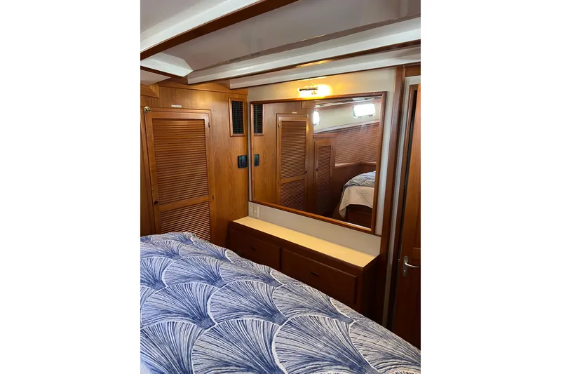 Slide: The Image of Cozy cabin interior of 2008 Krogen 48 North Sea yacht with wooden furnishings. - 34