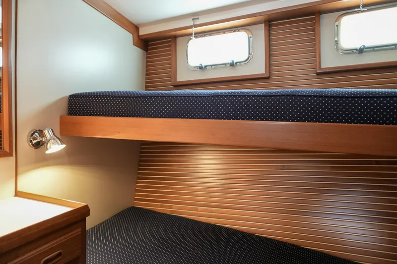 Slide: The Image of Cozy cabin interior of 2008 Kadey-Krogen 48 North Sea with bunk beds and wood paneling. - 37
