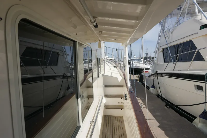Slide: The Image of Side deck view of 2008 Kadey-Krogen 48 North Sea yacht docked at marina. - 44