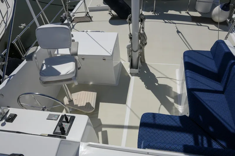 Slide: The Image of 2008 Kadey-Krogen 48 North Sea yacht cockpit with helm chair and blue seating. - 57