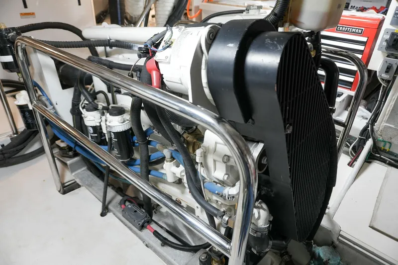 Slide: The Image of Engine room of 2008 Kadey-Krogen 48 North Sea yacht, showcasing mechanical components and piping. - 66