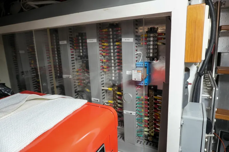 Slide: The Image of Electrical panel inside a 2008 Kadey-Krogen 48 North Sea yacht, showcasing wiring and components. - 69