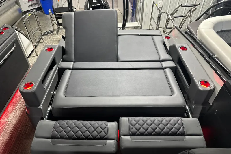 Slide: The Image of Luxury seating on 2026 Godfrey AP 255 DFLW boat with cup holders and quilted accents. - 11
