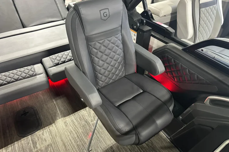 Slide: The Image of Luxurious seating in 2026 Godfrey AP 255 DFLW boat with quilted design and ambient lighting. - 13