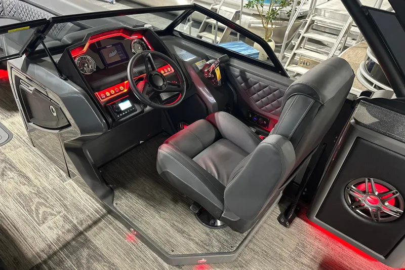 Slide: The Image of Luxurious 2026 Godfrey AP 255 DFLW boat interior with modern dashboard and leather seating. - 14