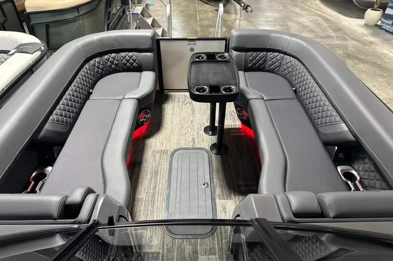 Slide: The Image of Luxurious interior of 2026 Godfrey AP 255 DFLW pontoon boat with plush seating and table. - 16