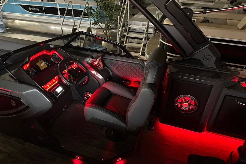 Slide: The Image of Luxurious 2026 Godfrey AP 255 DFLW boat interior with red ambient lighting. - 18