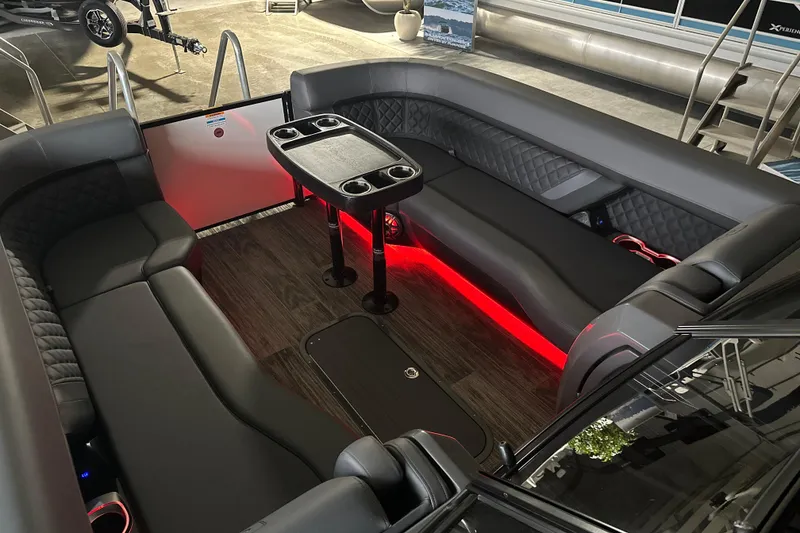 Slide: The Image of Luxurious interior of 2026 Godfrey AP 255 DFLW pontoon boat with ambient red lighting. - 19