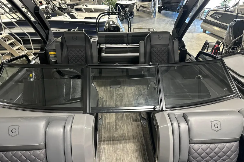 Slide: The Image of 2026 Godfrey AP 255 DFLW boat interior with luxurious seating and modern design. - 4