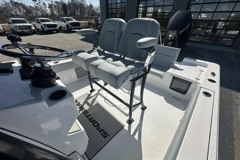 Slide: The Image of 2026 Sportsman Masters 247 Bay Boat interior with dual seating and steering console. - 12
