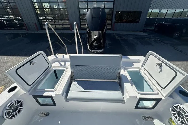 Slide: The Image of 2026 Sportsman Masters 247 Bay Boat interior with open storage compartments and seating. - 13