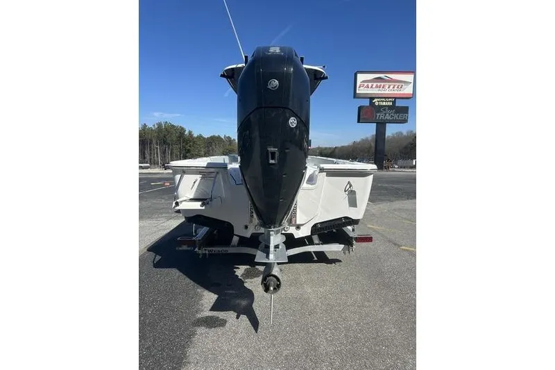 Slide: The Image of 2026 Sportsman Masters 247 Bay Boat rear view with powerful outboard motor. - 3