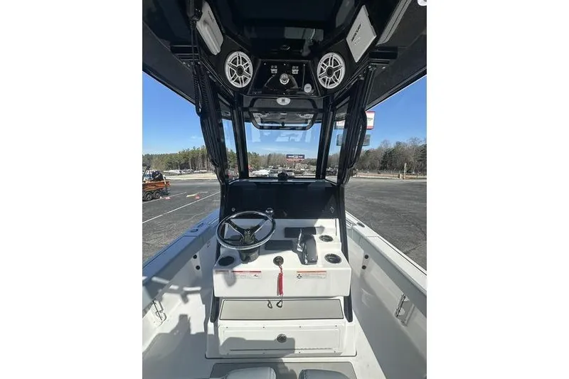 Slide: The Image of 2026 Sportsman Masters 247 Bay Boat cockpit with steering wheel and control panel. - 6